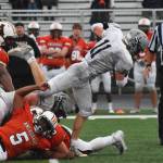 Soldotna senior Brenner Furlong breaks free of a cluster of West defenders Friday at West Anchorage High School. (Photo by Joey Klecka/Peninsula Clarion)