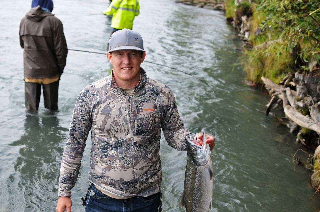 McKay Mills of Show Low, Arizona, holds up the sockeye salmon he caught near Soldotna Creek Park on Wednesday, Aug. 16, 2017 in Soldotna, Alaska. (Photo by Elizabeth Earl/Peninsula Clarion) McKay Mills of Show Low, Arizona, holds up the sockeye salmon he caught near Soldotna Creek Park on Wednesday, Aug. 16, 2017 in Soldotna, Alaska. (Photo by Elizabeth Earl/Peninsula Clarion)