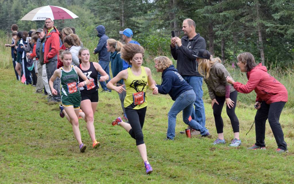 Soldotna&rsquo;s Kellie Arthur runs down a hill Saturday, Aug. 19, 2017, at the Tsalteshi Invitational. (Photo by Jeff Helminiak/Peninsula Clarion)