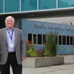 South Peninsula Hospital CEO Robert Letson poses for a photo in front of the hospital&rsquo;s Bartlett Street entrance on July 9, 2016, for SPH&rsquo;s 60th Anniversary Party. (Homer News file photo, Anna Frost)