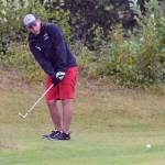 Max Dye chips onto the 18th green Sunday, Aug. 20, 2017, at the Kenai Golf Course during the Kenai Open. Dye would make bogey on the hole to win by one stroke. (Photo by Jeff Helminiak/Peninsula Clarion)