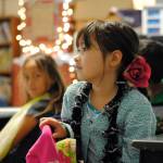 Third-grader Ruka Olson listens as her teacher, Tanya Erwin, details the expectations in the classroom for the year on the first day of school at Nikiski North Star Elementary School on Tuesday, Aug. 22, 2017 in Nikiski, Alaska. (Photo by Kat Sorensen/Peninsula Clarion)