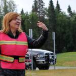 Nikiski North Star Elementary School Principal Margaret Gilman guides students and parents to and from the entrance of the school on the first day of school, Tuesday, Aug. 22, 2017 in Nikiski, Alaska. (Photo by Kat Sorensen/Peninsula Clarion)
