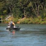 Anglers cast for silver salmon from a boat on the Kenai River downstream of the David E. Douthit Veterans Memorial Bridge on Tuesday, Aug. 22, 2017 in Soldotna, Alaska. (Photo by Elizabeth Earl/Peninsula Clarion)