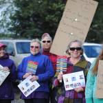 Community members gather in Soldotna Creek Park on Wednesday, August 16 in memorium of Heather Heyer, the woman killed during protests in Charlottesville, Virginia earlier this month. Organizers of the memorial walk have decided to continue the event for the next two weeks. (Photo by Kat Sorensen/Peninsula Clarion)