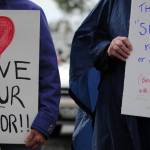 Community members gather in Soldotna Creek Park on Wednesday, August 16 in memorium of Heather Heyer, the woman killed during protests in Charlottesville, Virginia earlier this month. Organizers of the memorial walk have decided to continue the event for the next two weeks. (Photo by Kat Sorensen/Peninsula Clarion)