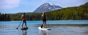 Stand-up paddle boarders explore the waterways of the Kenai Peninsula with Courtney Larsen&rsquo;s Adventure Guru. (Photo courtesy of Courtney Larsen)