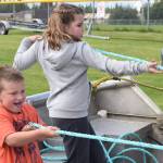 Cody Schaefer, left, and Shayla Smith compete against each other in a net pull at Industry Appreciation Day on Saturday, Aug. 26, 2017 in Kenai, Alaska. (Photo by Kat Sorensen/Peninsula Clarion)