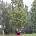 Birch Ridge assistant pro Beau Forrest hits an approach shot to No. 18 during a playoff at the Kenai Peninsula Open at Birch Ridge Golf Course on Sunday, Aug. 27, 2017. (Photo by Jeff Helminiak/Peninsula Clarion)