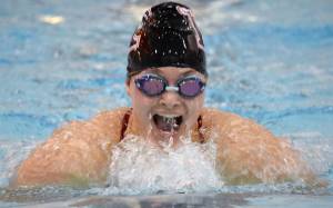 Kenai Central&rsquo;s Faith Ivy takes second in the 100-yard breaststroke Friday, Sept. 1, 2017, at the Kenai Quad Meet at Kenai Central High School. (Photo by Jeff Helminiak/Peninsula Clarion)