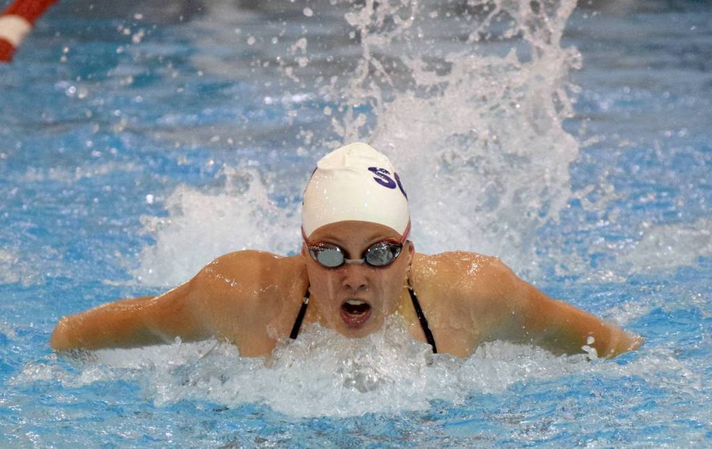 Soldotna&rsquo;s Sydney Juliussen swims to victory in the 100-yard butterfly Friday, Sept. 1, 2017, at the Kenai Quad Meet at Kenai Central High School. (Photo by Jeff Helminiak/Peninsula Clarion)