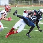 Eagle River&rsquo;s Justice Townsend is tackled by Kenai&rsquo;s Titus Riddall during Kenai&rsquo;s 42-28 Northern Lights Conference football win over the Wolves on Saturday, Sept. 2, 2017 at Eagle River High School. (Star photo by Matt Tunseth)