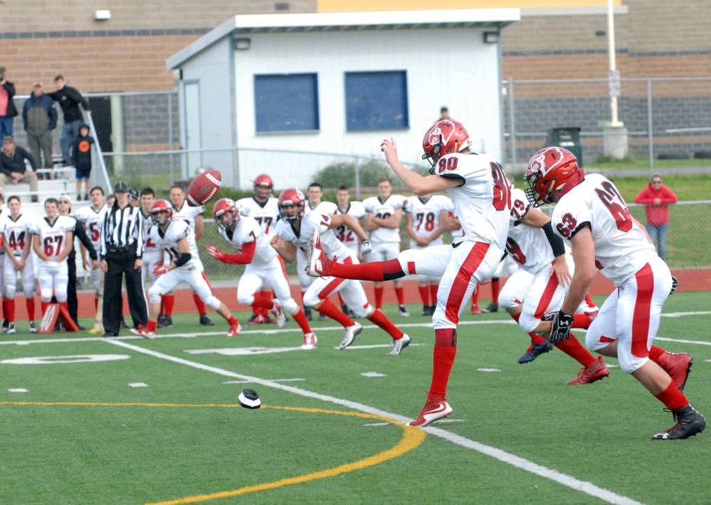Kenai&rsquo;s Kaden McKibben kicks off during the Kardinals&rsquo; 42-28 Northern Lights Conference football win over Eagle River on Saturday, Sept. 2, 2017 at Eagle River High School. (Star photo by Matt Tunseth)