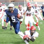 Eagle River&rsquo;s Quanard Cox is tackled by Kenai&rsquo;s Zack Tuttle during Kenai&rsquo;s 42-28 Northern Lights Conference football win over the Wolves on Saturday, Sept. 2, 2017 at Eagle River High School. (Star photo by Matt Tunseth)