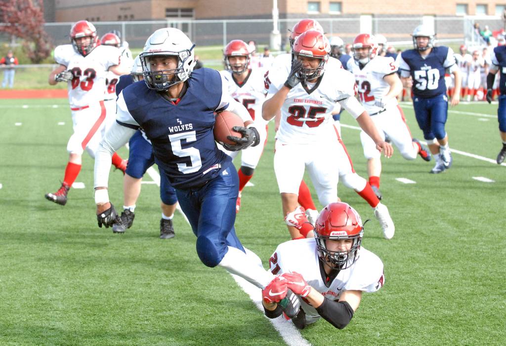 Eagle River&rsquo;s Quanard Cox is tackled by Kenai&rsquo;s Zack Tuttle during Kenai&rsquo;s 42-28 Northern Lights Conference football win over the Wolves on Saturday, Sept. 2, 2017 at Eagle River High School. (Star photo by Matt Tunseth)