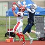 Kenai&rsquo;s Titus Riddall intercepts a pass intended for Eagle River&rsquo;s Bryson Rollman during the Kardinals&rsquo; 42-28 Northern Lights Conference football win over the Wolves on Saturday, Sept. 2, 2017 at Eagle River High School. (Star photo by Matt Tunseth)