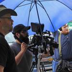 In an Aug. 9 photo, director Charles Baird, left, director of photography Michael Bergstrom, center, and sound man Andrew Wolfe film a scene from &ldquo;Telltale&rdquo; in Eagle River, Alaska. The film is one of two independent movies produced by Alaska filmmaker Charles Baird that were filmed in Eagle River the summer of 2017. (Kirsten Swann/Chugiak-Eagle River Star via AP)