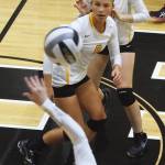 Nikiski&rsquo;s Kaitlyn Johnson (8) eyes the ball while Ashlee Tyner sets up behind her Thursday night at Nikiski High School. (Photo by Joey Klecka/Peninsula Clarion)