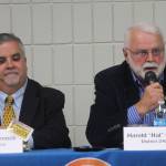 Duane Bannock, left, listens while Hal Smalley answers a question during a forum for Kenai Peninsula Borough Assembly candidates Wednesday at a joint meeting of the Kenai and Soldotna Chambers of Commerce. Bannock and Smalley are running for the District 2-Kenai seat. (Photo by Will Morrow/Peninsula Clarion)