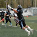 Chugiak&rsquo;s Derryk Snell leaps to catch a pass during Chugiak&rsquo;s 48-0 nonconference high school football win over Kenai on Friday, Sept. 15, 2017 at Tom Huffer Sr. Stadium in Chugiak. (Star photo by Matt Tunseth)