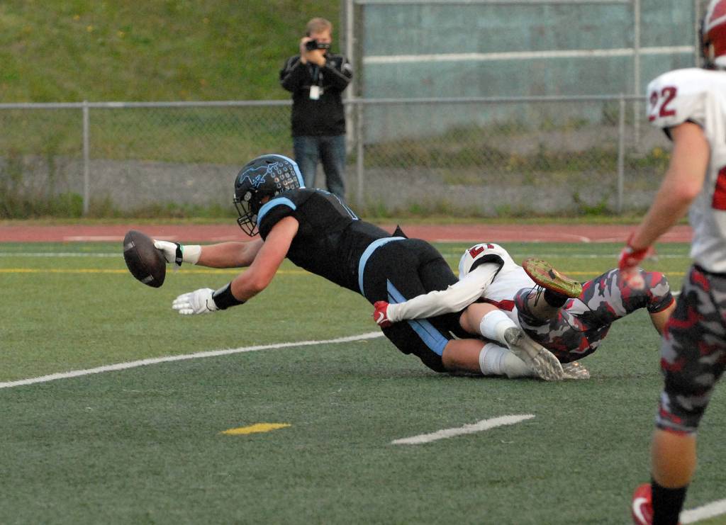Chugiak&rsquo;s Derryk Snell scores one of his five touchdowns during Chugiak&rsquo;s 48-0 nonconference high school football win over Kenai on Friday, Sept. 15, 2017 at Tom Huffer Sr. Stadium in Chugiak. (Star photo by Matt Tunseth)