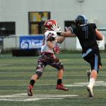 Chugiak&rsquo;s Derryk Snell stiffarms Kenai Central&rsquo;s Titus Riddall during Chugiak&rsquo;s 48-0 nonconference high school football win over Kenai on Friday, Sept. 15, 2017 at Tom Huffer Sr. Stadium in Chugiak. (Star photo by Matt Tunseth)