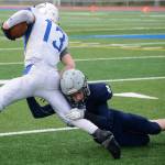 Soldotna defensive back Jersey Truesdell goes in for a tackle on Kodiak running back Kaleb Finley (13) Saturday at Justin Maile Field in Soldotna. (Photo by Joey Klecka/Peninsula Clarion)
