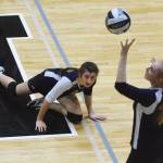 Homer sophomore Marina Carroll watches as teammate Kelli Bishop sends the ball into Nikiski&rsquo;s court Tuesday night at Nikiski High School. (Photo by Joey Klecka/Peninsula Clarion)