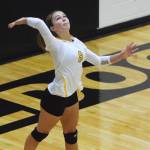 Nikiski sophomore Kaitlyn Johnson serves up a ball to Homer Tuesday night at Nikiski High School. (Photo by Joey Klecka/Peninsula Clarion)