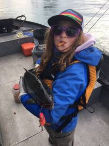 Lily Craig shows off the silver salmon she caught on the Kenai River during the Kenai Chamber of Commerce&rsquo;s first annual silver salmon derby in September 2017. (Photo courtesy Nathaniel Craig)