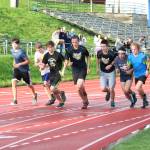 A group of male runners takes off from the starting line of the Mariner Mile, a new event held Thursday, Sept. 14, 2017 at the Homer High School running track in Homer, Alaska. The event, in which people could sign up to run one mile around the track in different heats, was a fundraiser for the Kachemak Bay Running Club. (Photo by Megan Pacer/Homer News)