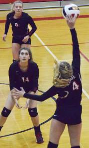 Kenai Central&rsquo;s Denali Lockwood gets her fingers on a ball while teammate Sam Kompkoff (14) watches Thursday against Kodiak at Kenai Central High School. (Photo by Joey Klecka/Peninsula Clarion)
