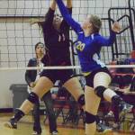 Kenai&rsquo;s Jaiden Streiff blocks a shot by Kodiak&rsquo;s Kathleen Banks (20) Thursday at Kenai Central High School. (Photo by Joey Klecka/Peninsula Clarion)