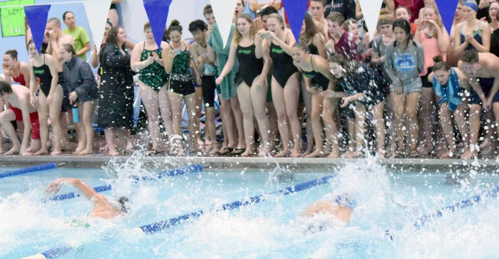 Colony&rsquo;s Jake Simmons and Kodiak&rsquo;s Talon Lindquist duke it out in the 50-yard freestyle before teammates Friday, Sept. 22, 2017, at the Soldotna Pentathlon at Soldotna High School. Lindquist won the race and the Pentathlon title. (Photo by Jeff Helminiak/Peninsula Clarion)