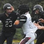 Nikiski freshman Caileb Payne (23) eyes Eielson running back Jiro Dobashi-Noa for a tackle Friday evening at Nikiski High School. (Photo by Joey Klecka/Peninsula Clarion)