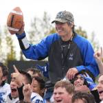 Palmer football coach Rod Christianson celebrates his 151st career coaching win with the Moose, Saturday at Ed Hollier field in Kenai. The milestone victory placed Christianson atop the all-time Alaska football coaching win list. (Photo by Joey Klecka/Peninsula Clarion)