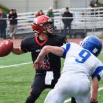 Kenai Central junior quarterback Connor Felchle (3) winds up for a throw against Palmer, Saturday at Ed Hollier field in Kenai. (Photo by Joey Klecka/Peninsula Clarion)