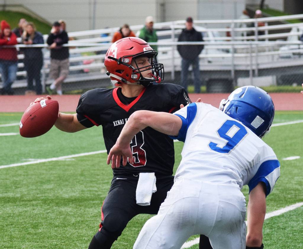 Kenai Central junior quarterback Connor Felchle (3) winds up for a throw against Palmer, Saturday at Ed Hollier field in Kenai. (Photo by Joey Klecka/Peninsula Clarion)