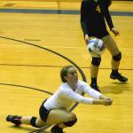 Seward libero Ashley Jackson (white) dives for a dig on the ball while teammate Randi Tolson looks on Tuesday night at Soldotna High School. (Photo by Joey Klecka/Peninsula Clarion)