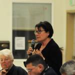 Linda Hutchings (standing), a candidate for Kenai Peninsula Borough mayor, answers a question during a forum with fellow candidates Dale Bagley (center) and Charlie Pierce (right) at the Funny River Community Center on Thursday, Aug. 16, 2017 in Funny River, Alaska. (Photo by Elizabeth Earl/Peninsula Clarion, file)