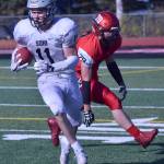 Soldotna&rsquo;s Brenner Furlong turns upfield after eluding Kenai&rsquo;s Jarett Wilson on a kickoff return Saturday, Sept. 30, 2017, at Ed Hollier Field in Kenai. (Photo by Jeff Helminiak/Peninsula Clarion)