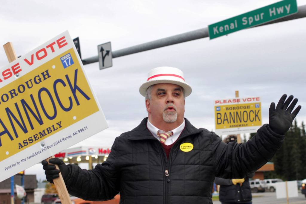 Kenai Peninsula Borough Assembly candidate Duane Bannock whistles while waving to cars at the intersection of the Kenai Spur Highway and Bridge Acess Road on election day, Tuesday, Oct. 3, 2017 in Kenai, Alaska. (Ben Boettger/Peninsula Clarion)