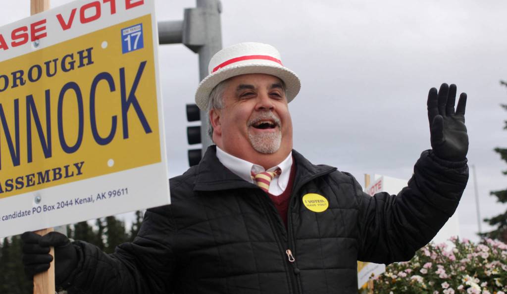 Kenai Peninsula Borough Assembly candidate Duane Bannock waves to cars at the intersection of the Kenai Spur Highway and Bridge Acess Road on election day, Tuesday, Oct. 3, 2017 in Kenai, Alaska. (Ben Boettger/Peninsula Clarion)