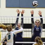 Soldotna&rsquo;s Ella Stenga and Bailey Leach (12) put up a block against Nikiski&rsquo;s Jamie Yerkes (9) Tuesday at Nikiski High School. (Photo by Joey Klecka/Peninsula Clarion)