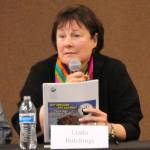 Linda Hutchings speaks during a forum for borough mayoral candidates last month. (Photo by Will Morrow/Peninsula Clarion)