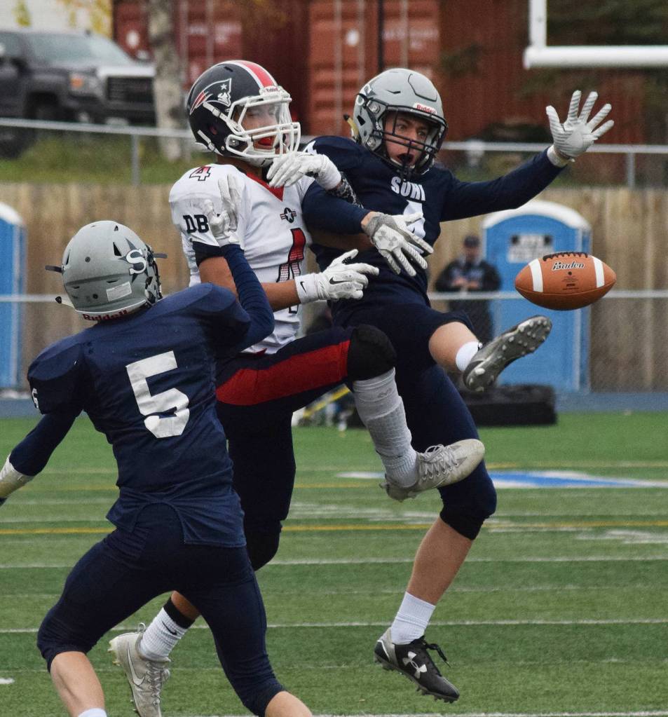 North Pole receiver Jamie Johnson comes up empty as Soldotna defenders Luke Trammell (5) and Jersey Truesdell team up in coverage Saturday at the ASAA First National Bank state football semifinals at Palmer High School. (Photo by Joey Klecka/Peninsula Clarion)