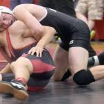 Nikiski&rsquo;s Justin Cox controls Kenai Central&rsquo;s Brandon Kroto on Saturday, Oct. 14, 2017, at the Luke Spruill Memorial Tournament at Kenai Central High School. Cox took a 13-1 major decision en route to winning first at 138 pounds. (Photo by Jeff Helminiak/Peninsula Clarion)