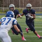 Soldotna sophomore Aaron Faletoi (right) follows senior teammate Brandon Crowder Saturday against Palmer in the ASAA First National Bank Division II state championship at Machetanz Field in Palmer. (Photo by Joey Klecka/Peninsula Clarion)