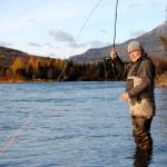 TOP: Brant Koetting, a fishing guide with Tower Rock Lodge, holds out one of his bead selections for fishing the Upper River Kenai in Alaska on Oct. 11, 2017. (Photo by Kat Sorensen/Peninsula Clarion)  ABOVE: Mike Tuhy, owner and operator of the Tower Rock Lodge in Kenai casts for trout in the Upper River Kenai on Oct. 11. (Photo by Kat Sorensen/Peninsula Clarion) BELOW: Novice fly angler and writer of this story holds out a rainbow trout she managed to catch on her first fly fishing trip with Michael Tuhy and Brant Koetting of Tower Rock Lodge in the Upper River Kenai in Alaska on Oct. 11. (Photo by Brant Koetting)