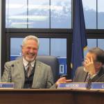 Alaska state Senate President Pete Kelly, left, laughs with Sen. Peter Micciche following a Senate committee meeting on Monday in Juneau. Legislators on Monday convened for their fourth special session of the year, this one called by the governor to address taxes and crime. (AP Photo/Becky Bohrer)